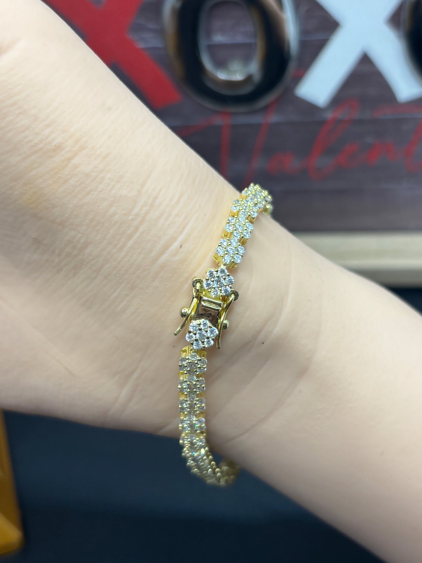 Cute 6.5” gold over sterling silver zirconia flower bracelet