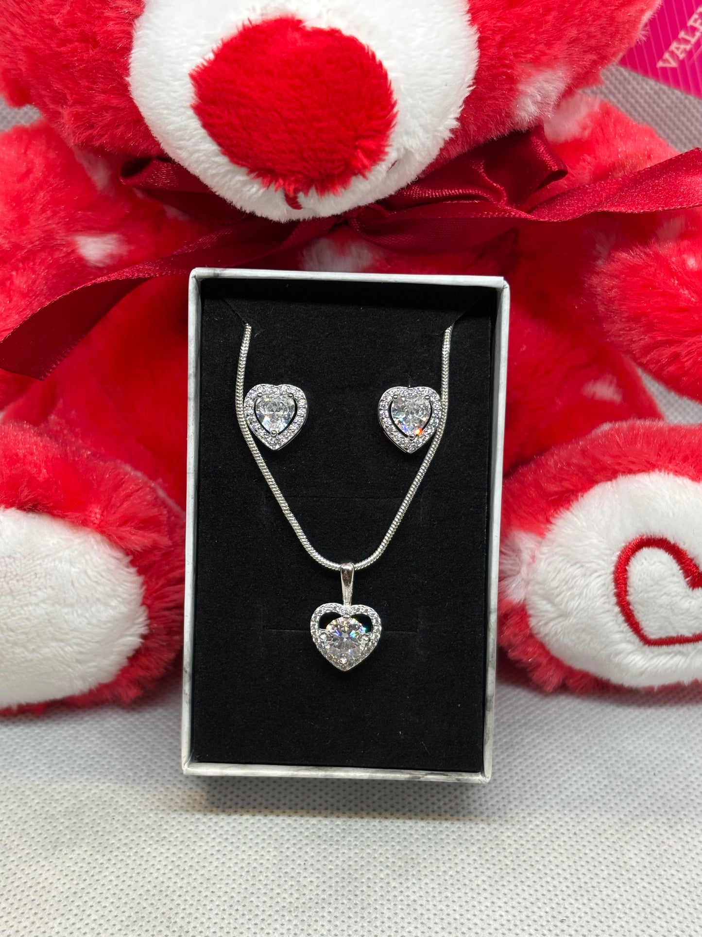 Sterling silver necklace & earring sets.