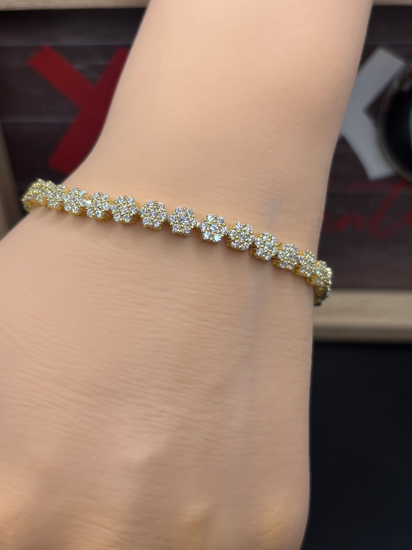 Cute 6.5” gold over sterling silver zirconia flower bracelet