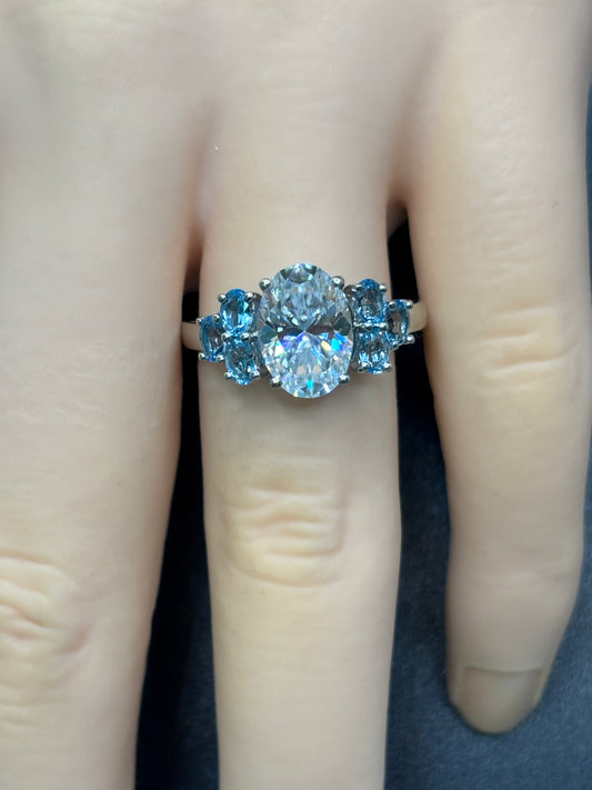 14k white gold ring with 2.5ct oval Moissanite & genuine blue topaz accent stones