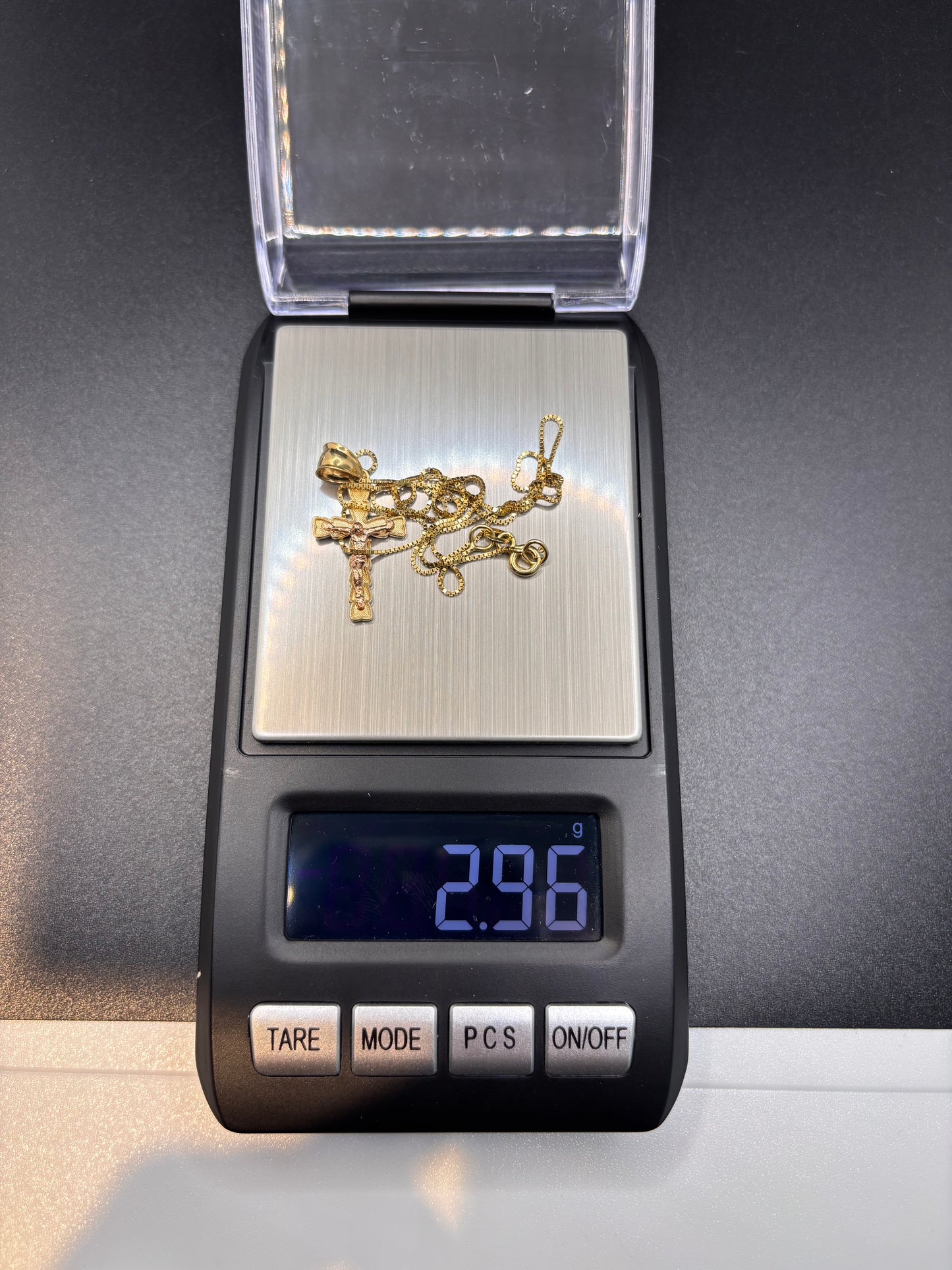 14k y/g 18” box chain with 10k gold crucifix cross